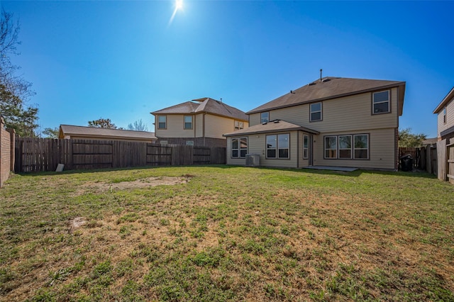24114 Morrison Ln, Katy, TX 77493 - rear view of house featuring a yard and a fenced backyard