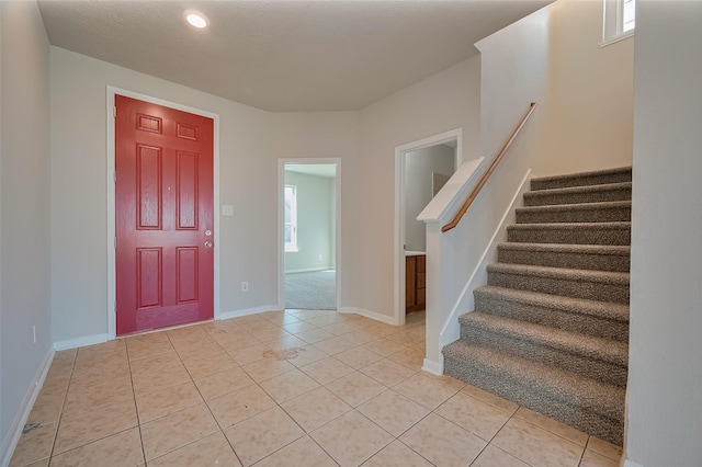 24114 Morrison Ln, Katy, TX 77493 - entryway featuring baseboards, recessed lighting, stairs, and light tile patterned floors