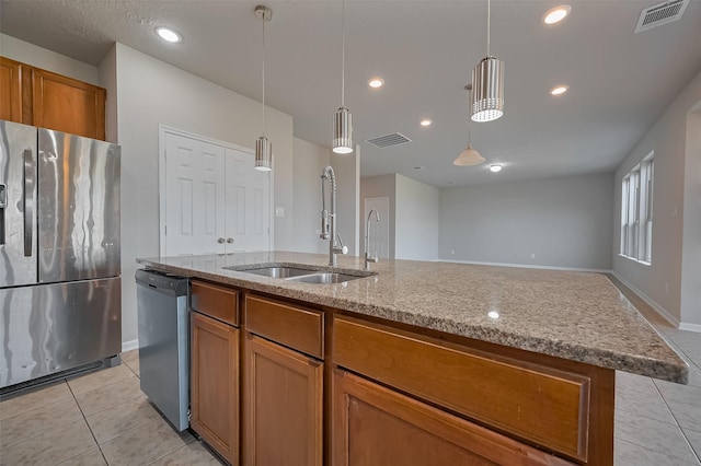 24114 Morrison Ln, Katy, TX 77493 - kitchen with visible vents, a sink, appliances with stainless steel finishes, and light tile patterned flooring
