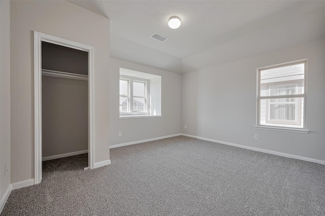24114 Morrison Ln, Katy, TX 77493 - unfurnished bedroom with visible vents, carpet floors, a closet, lofted ceiling, and baseboards