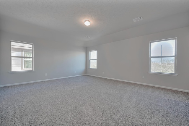 24114 Morrison Ln, Katy, TX 77493 - carpeted spare room featuring visible vents, a textured ceiling, and baseboards