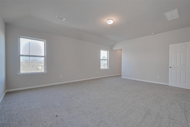 24114 Morrison Ln, Katy, TX 77493 - carpeted empty room featuring baseboards, visible vents, and lofted ceiling