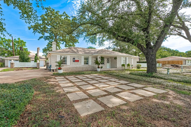 13018 Vernon Rd, Cypress, TX 77429 - view of front of house with brick siding and a chimney