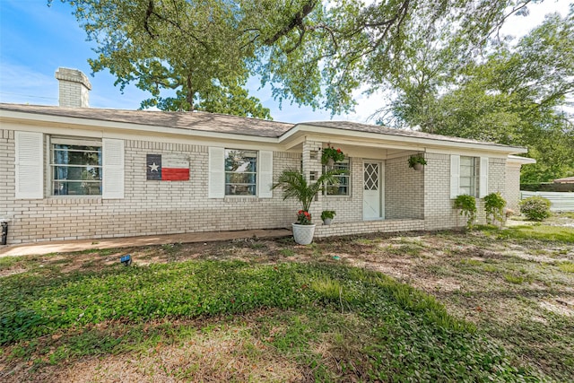 13018 Vernon Rd, Cypress, TX 77429 - single story home featuring brick siding and a chimney