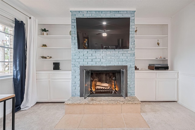 13018 Vernon Rd, Cypress, TX 77429 - unfurnished living room with built in shelves, light carpet, and a fireplace
