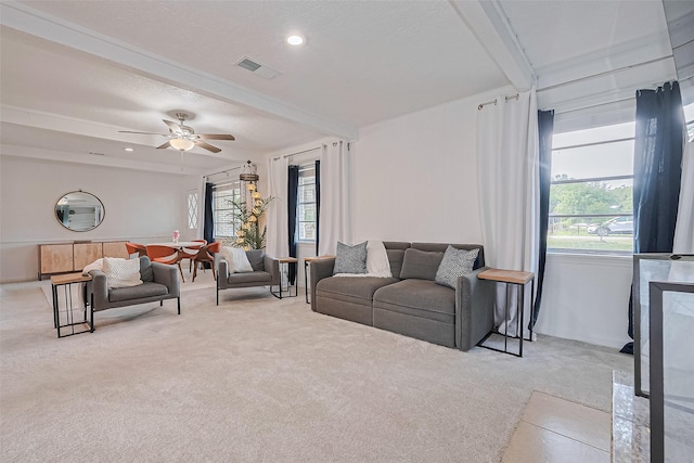 13018 Vernon Rd, Cypress, TX 77429 - carpeted living area with plenty of natural light, a ceiling fan, and beam ceiling