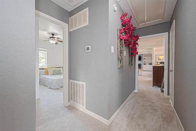 13018 Vernon Rd, Cypress, TX 77429 - hall featuring attic access, light colored carpet, baseboards, and a textured wall