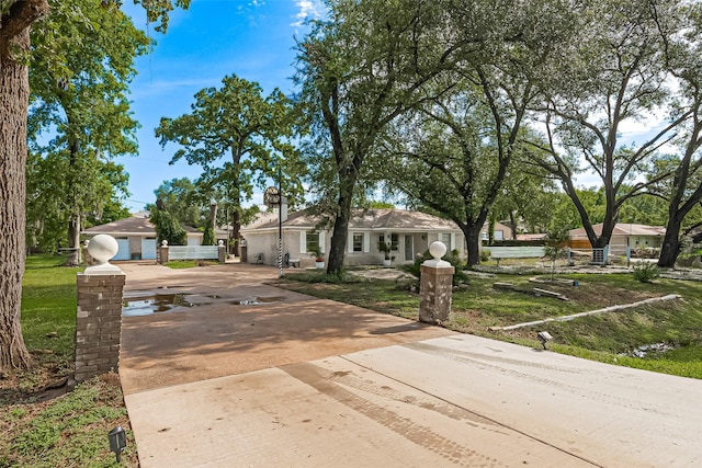 13018 Vernon Rd, Cypress, TX 77429 - view of front of house with driveway and a front lawn