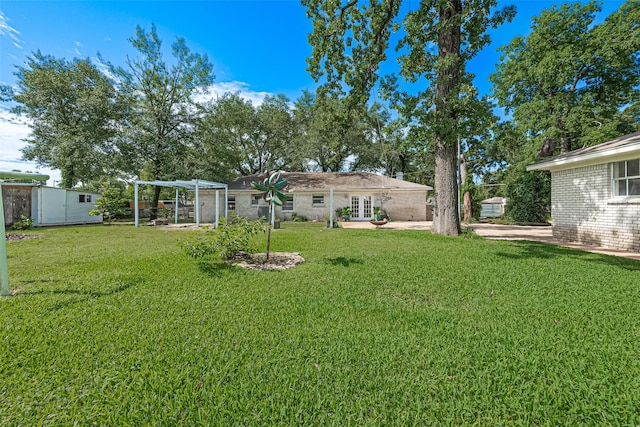13018 Vernon Rd, Cypress, TX 77429 - view of green lawn featuring french doors, a patio, and a pergola