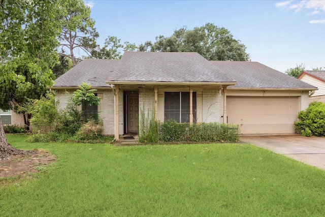 single story home with a garage, brick siding, a front lawn, and driveway