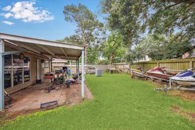 view of yard with a patio area and central AC unit
