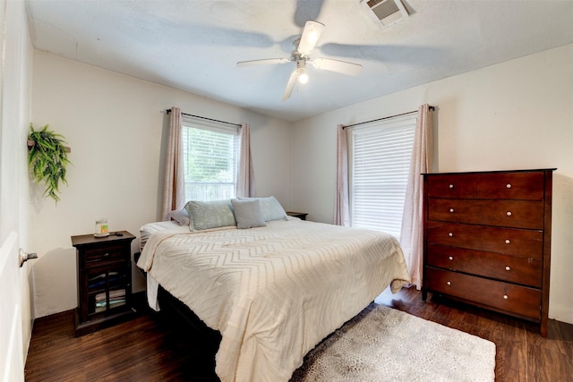 708 Gresham St, Baytown, TX 77520 - bedroom featuring a ceiling fan, dark wood finished floors, and visible vents