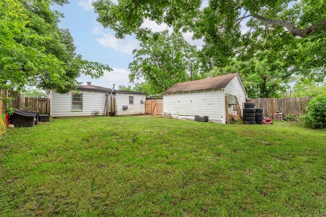 708 Gresham St, Baytown, TX 77520 - view of yard with an outbuilding, a fenced backyard, and a storage unit