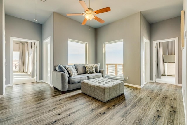 2386 Hwy 87, Gilchrist, TX 77617 - living area featuring light wood-style floors, attic access, baseboards, and ceiling fan