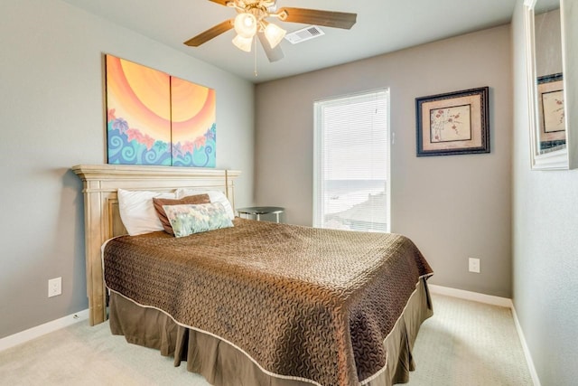 2386 Hwy 87, Gilchrist, TX 77617 - carpeted bedroom featuring baseboards, a ceiling fan, and visible vents