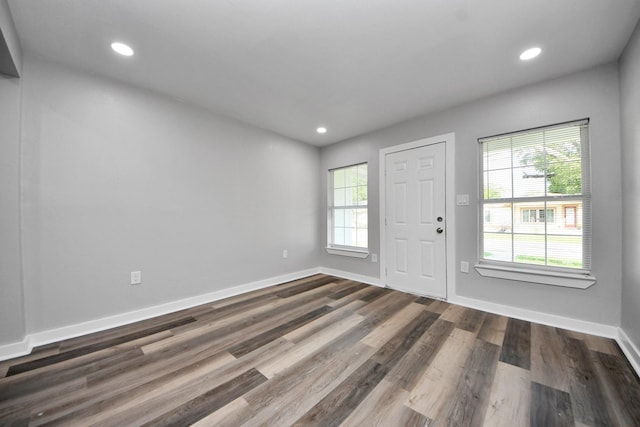 entrance foyer with recessed lighting, baseboards, and dark wood-style floors