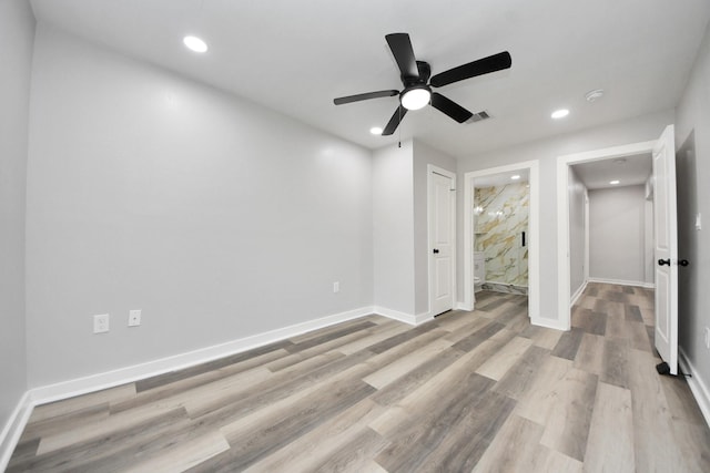 unfurnished bedroom featuring recessed lighting, baseboards, visible vents, and wood finished floors