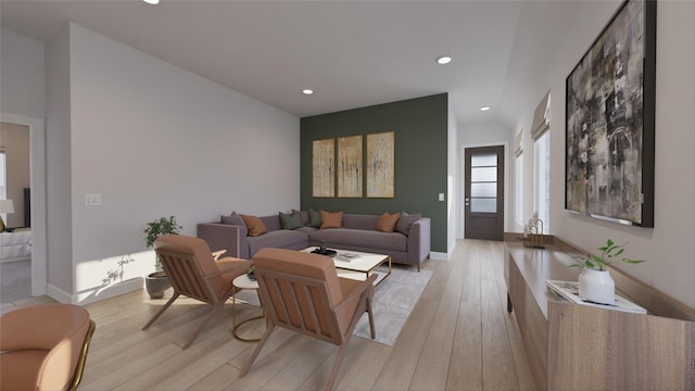 living area featuring baseboards, recessed lighting, and light wood-style flooring