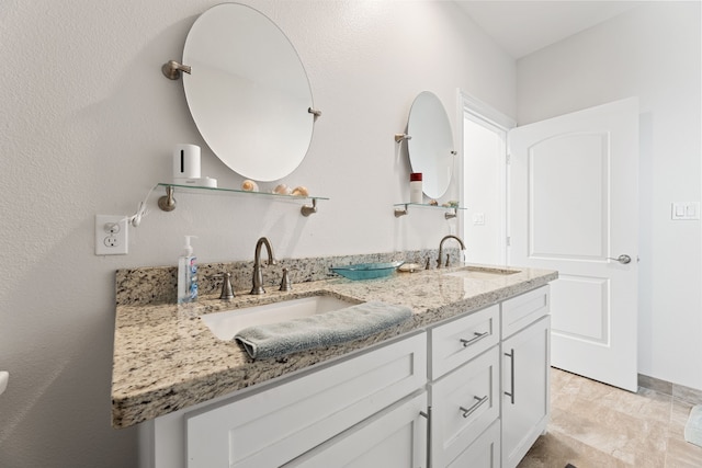 full bath featuring double vanity and a sink