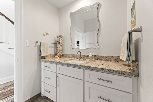 bathroom featuring vanity and baseboards