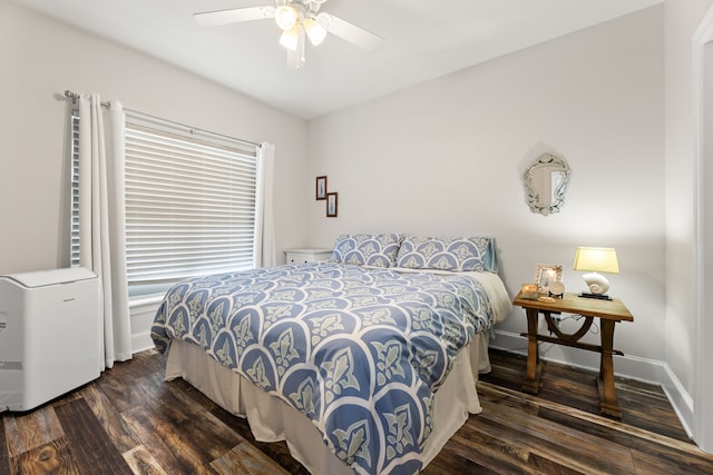 bedroom with a ceiling fan and dark wood finished floors