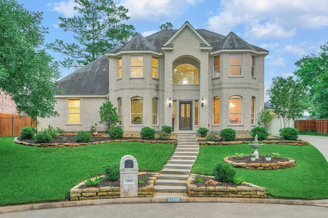french country inspired facade with brick siding and roof with shingles