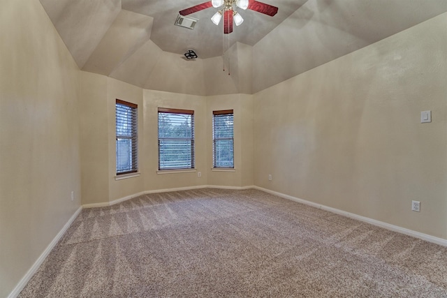 empty room with carpet flooring, ceiling fan, and baseboards