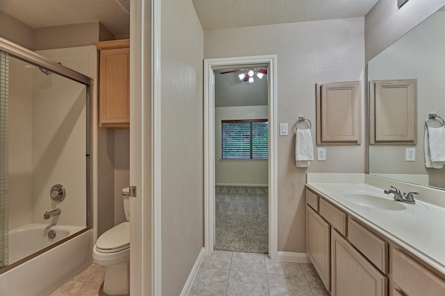 bathroom featuring tile patterned flooring, vanity, toilet, and shower / bath combination with glass door