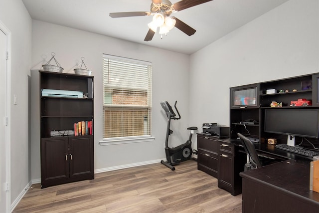 15502 Bosque Valley Ct, Cypress, TX 77433 - office area with baseboards, a ceiling fan, and light wood finished floors