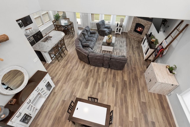 15502 Bosque Valley Ct, Cypress, TX 77433 - living room with wood finished floors and a fireplace