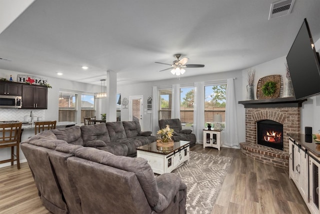 15502 Bosque Valley Ct, Cypress, TX 77433 - living room with visible vents, ceiling fan, wood finished floors, and a wealth of natural light