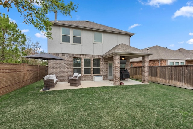 15502 Bosque Valley Ct, Cypress, TX 77433 - rear view of property featuring a fenced backyard, stucco siding, brick siding, a patio area, and a lawn