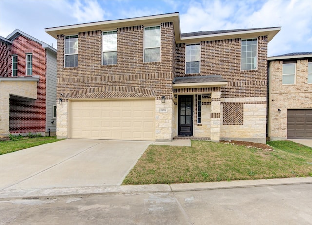 14514 Sanour Dr, Houston, TX 77084 - traditional-style house featuring driveway, a front lawn, stone siding, and a garage