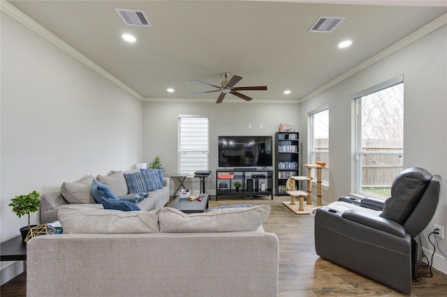 14514 Sanour Dr, Houston, TX 77084 - living area featuring crown molding, recessed lighting, ceiling fan, and visible vents