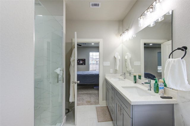 14514 Sanour Dr, Houston, TX 77084 - ensuite bathroom featuring a sink, ensuite bathroom, visible vents, and marble finish floor