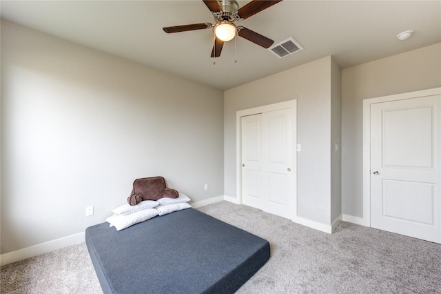14514 Sanour Dr, Houston, TX 77084 - workout room featuring carpet floors, ceiling fan, visible vents, and baseboards