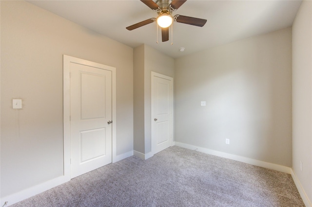 14514 Sanour Dr, Houston, TX 77084 - unfurnished bedroom featuring baseboards, ceiling fan, and carpet
