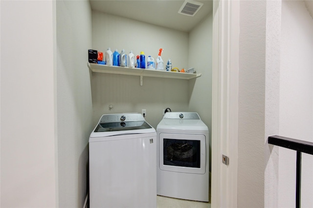 14514 Sanour Dr, Houston, TX 77084 - clothes washing area featuring laundry area, visible vents, and washing machine and dryer