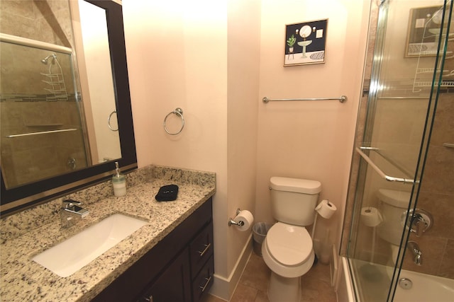 3804 Lovejoy St, Houston, TX 77003 - full bathroom with vanity, shower / bath combination with glass door, baseboards, and toilet