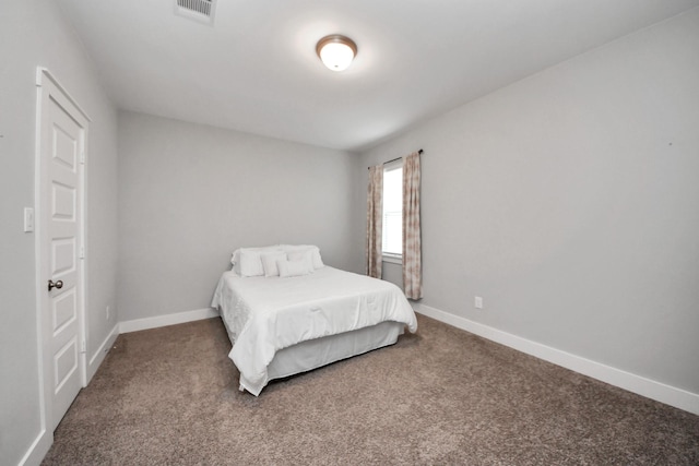 bedroom with carpet floors and baseboards