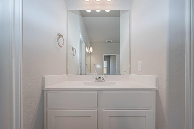 10103 Gold Finch Run, Magnolia, TX 77354 - bathroom with vanity, a textured wall, and visible vents