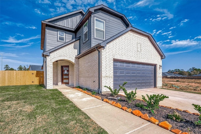 10103 Gold Finch Run, Magnolia, TX 77354 - traditional home with a garage, a front lawn, fence, brick siding, and driveway