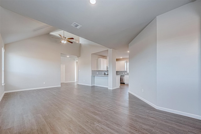 10103 Gold Finch Run, Magnolia, TX 77354 - unfurnished living room featuring baseboards, a ceiling fan, wood finished floors, and visible vents