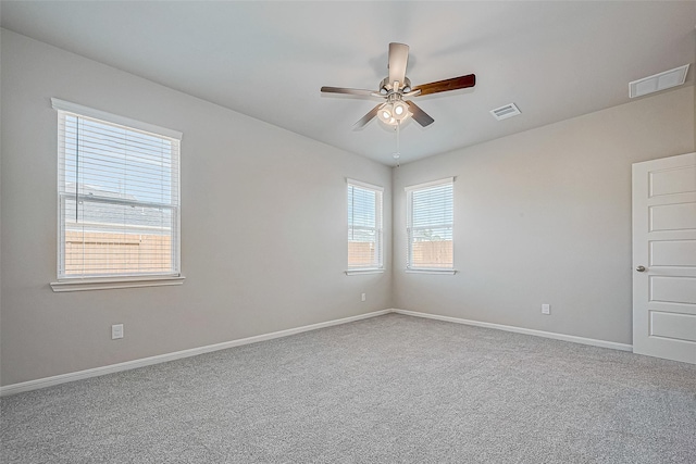 10103 Gold Finch Run, Magnolia, TX 77354 - carpeted spare room with visible vents, a ceiling fan, and baseboards