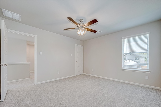 10103 Gold Finch Run, Magnolia, TX 77354 - empty room featuring visible vents, carpet, ceiling fan, and baseboards