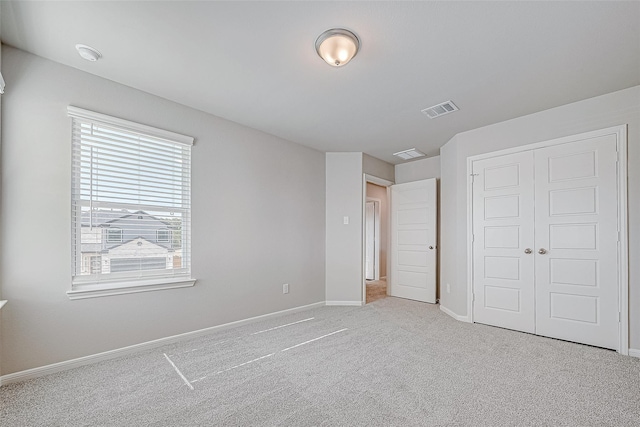 10103 Gold Finch Run, Magnolia, TX 77354 - unfurnished bedroom with visible vents, carpet flooring, baseboards, and a closet