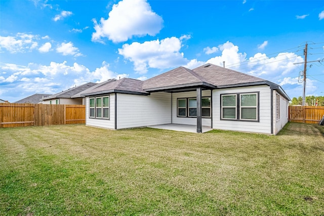 26234 Cooperstown Way, Splendora, TX 77372 - back of house with a fenced backyard, a lawn, and a patio area
