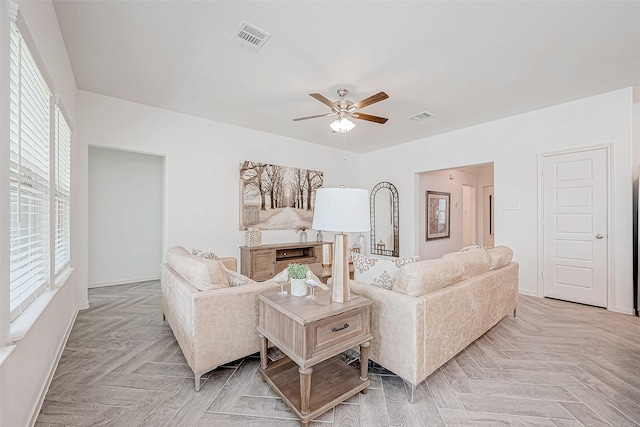 26234 Cooperstown Way, Splendora, TX 77372 - living area featuring visible vents, baseboards, and ceiling fan