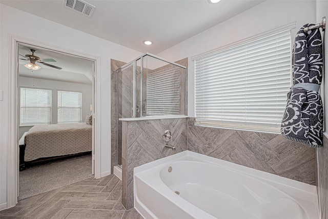 26234 Cooperstown Way, Splendora, TX 77372 - full bathroom featuring ceiling fan, ensuite bath, visible vents, a bath, and a stall shower