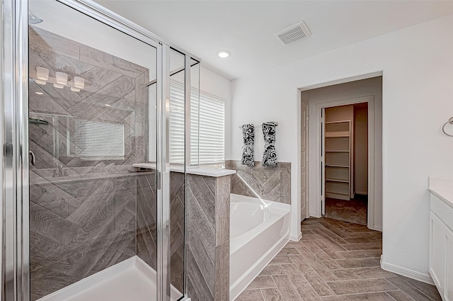 26234 Cooperstown Way, Splendora, TX 77372 - bathroom with visible vents, vanity, a garden tub, and a shower stall